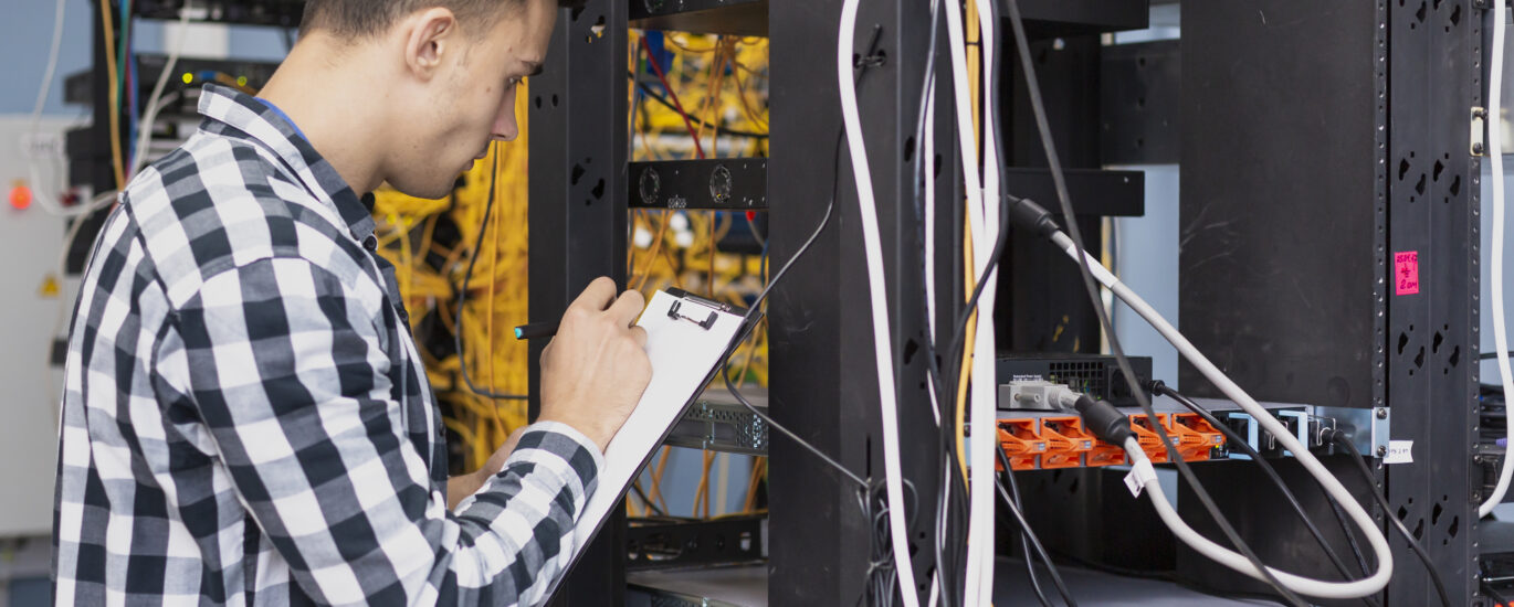 young engineer writing clipboard medium shot scaled