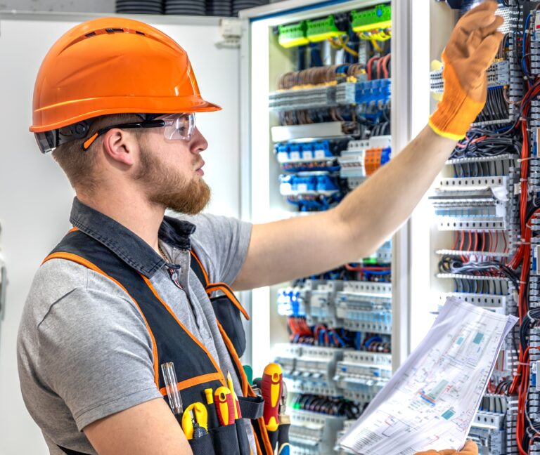 male electrician working electrical panel male electrician overalls 1 scaled